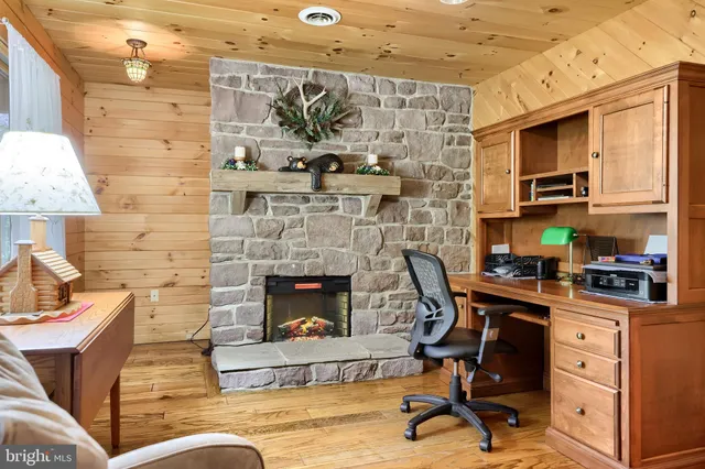 a large kitchen with stainless steel appliances granite countertop a stove a sink and a refrigerator