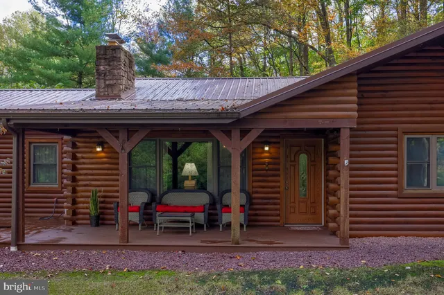 a front view of a house with a garden and porch