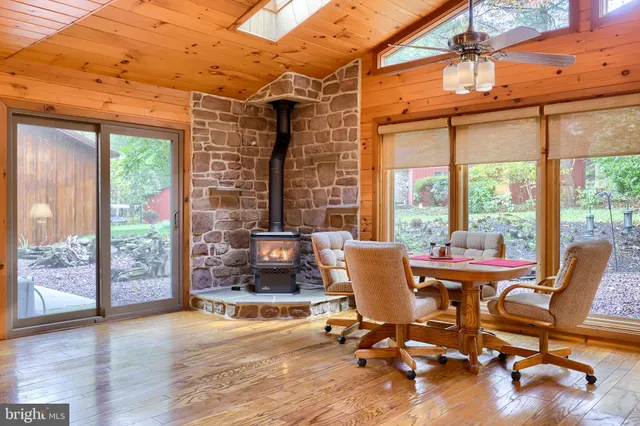 a spacious bathroom with a tub sink and mirror