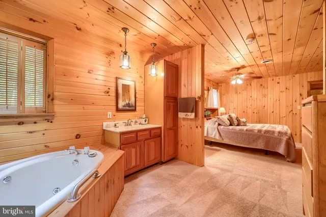 a dining room with furniture and a potted plant
