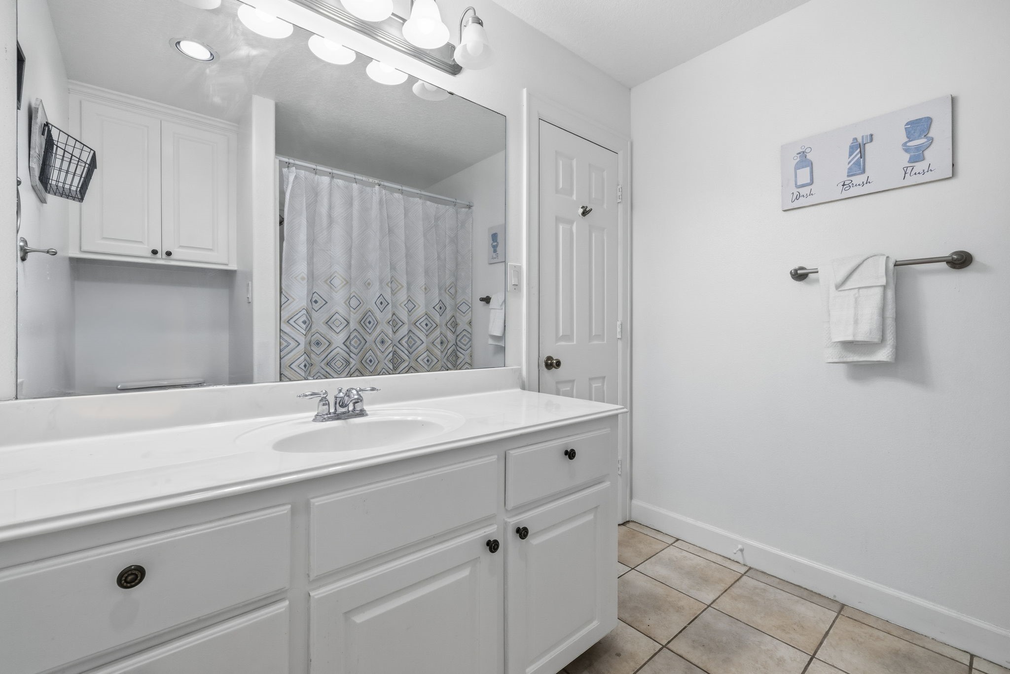 20407 Deer Run Road Damon, TX 77430 - Photo 21 of 29 a bathroom with a sink and a mirror