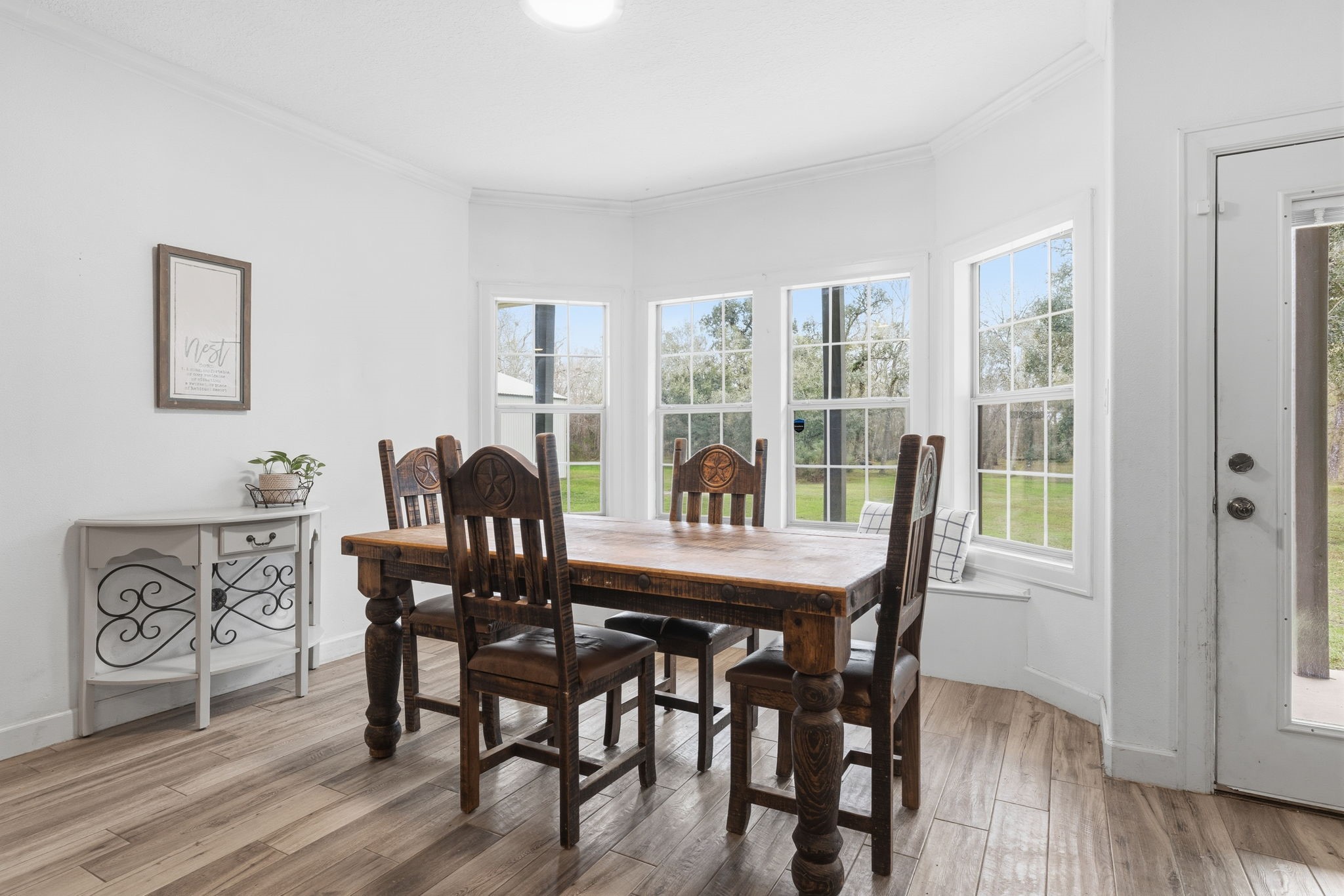 20407 Deer Run Road Damon, TX 77430 - Photo 3 of 29 a view of a dining room with furniture window and wooden floor