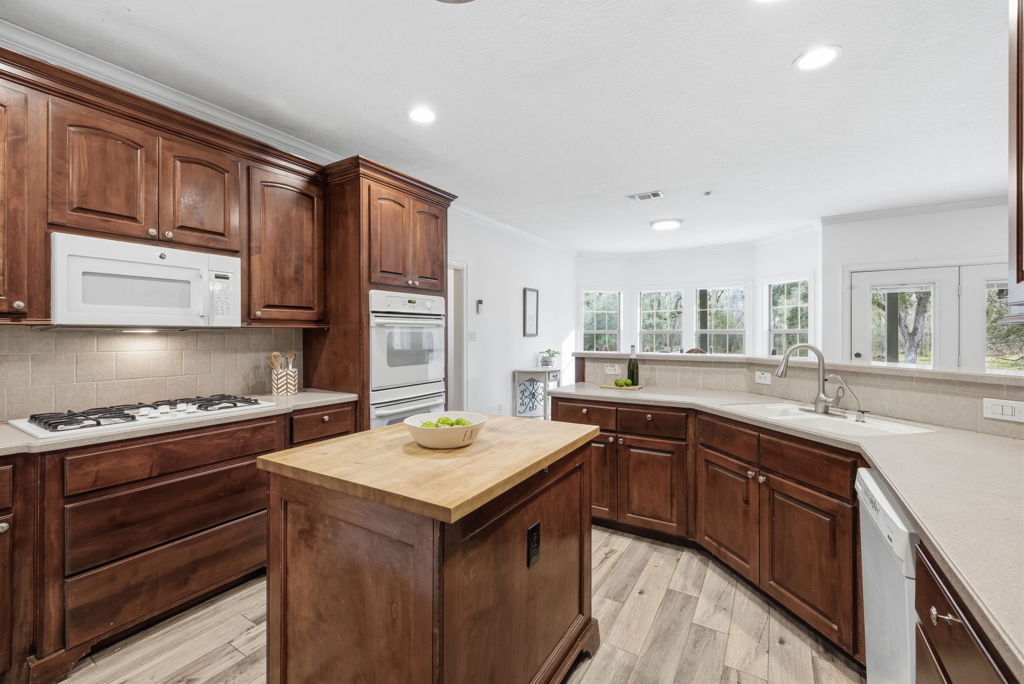 20407 Deer Run Road Damon, TX 77430 - Photo 4 of 29 a kitchen with a sink stove and cabinets