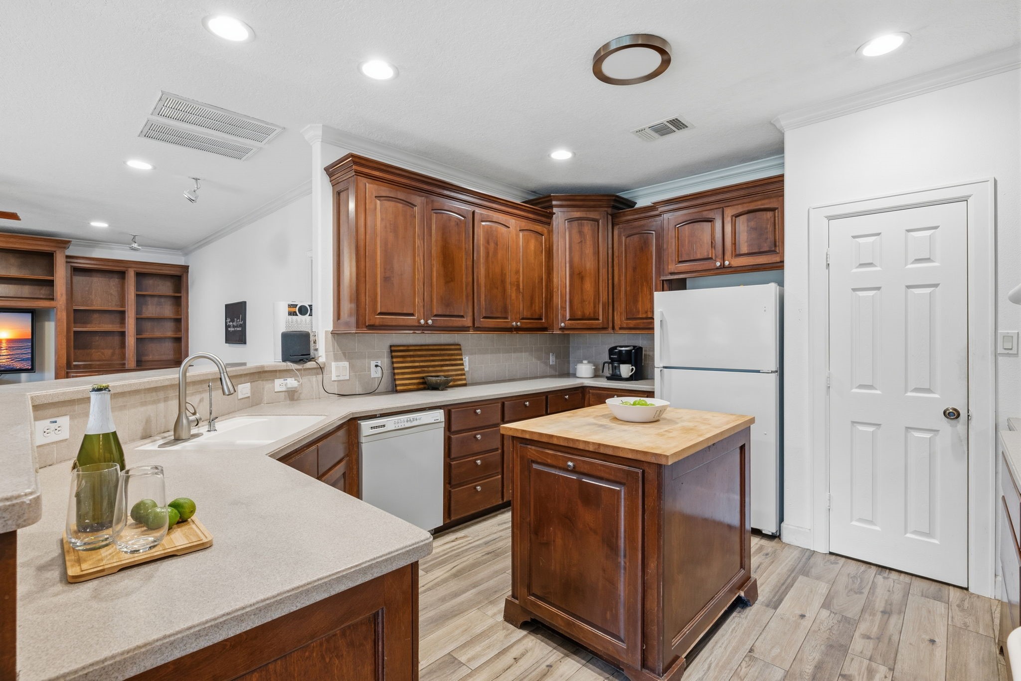 20407 Deer Run Road Damon, TX 77430 - Photo 8 of 29 a kitchen with kitchen island granite countertop a sink window and refrigerator