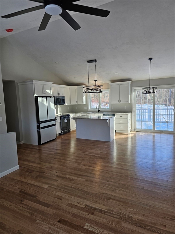 123 Keys Road Warren, MA 01585 - Photo 2 of 12 a view of a kitchen with microwave and stove