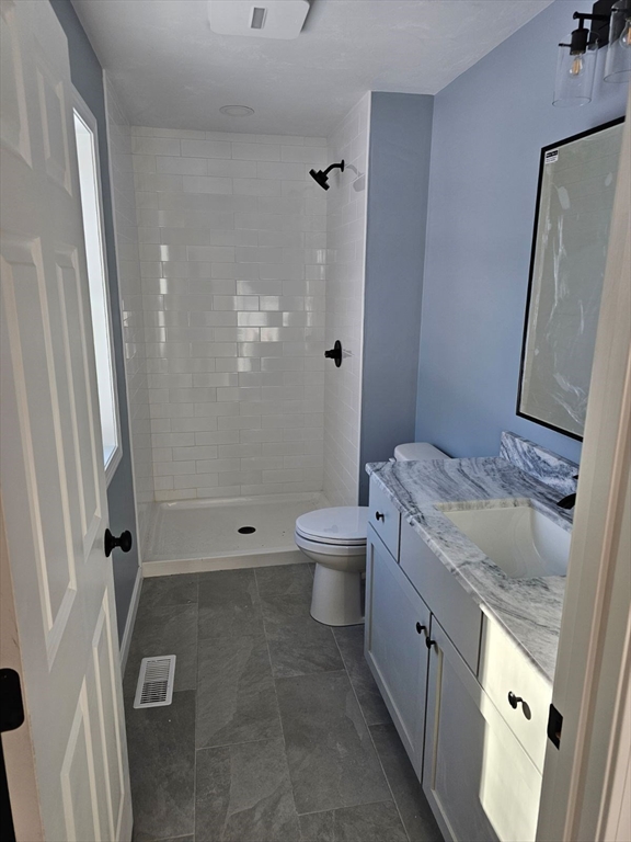 123 Keys Road Warren, MA 01585 - Photo 3 of 12 a bathroom with a granite countertop sink toilet and shower
