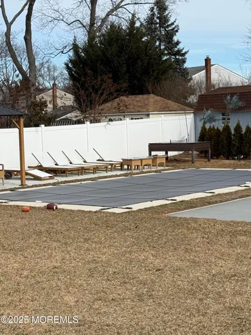 a view of a town with large trees