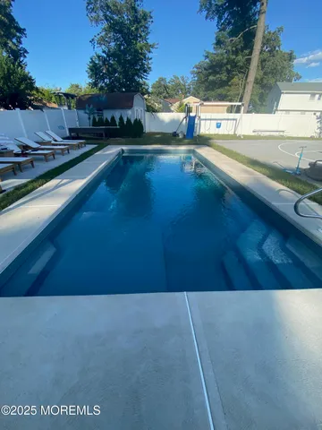 a view of a swimming pool with an outdoor space