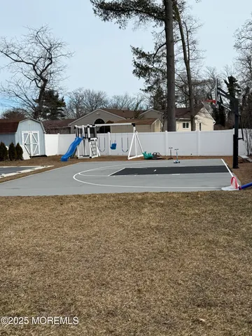 a view of a house with a yard and tree s