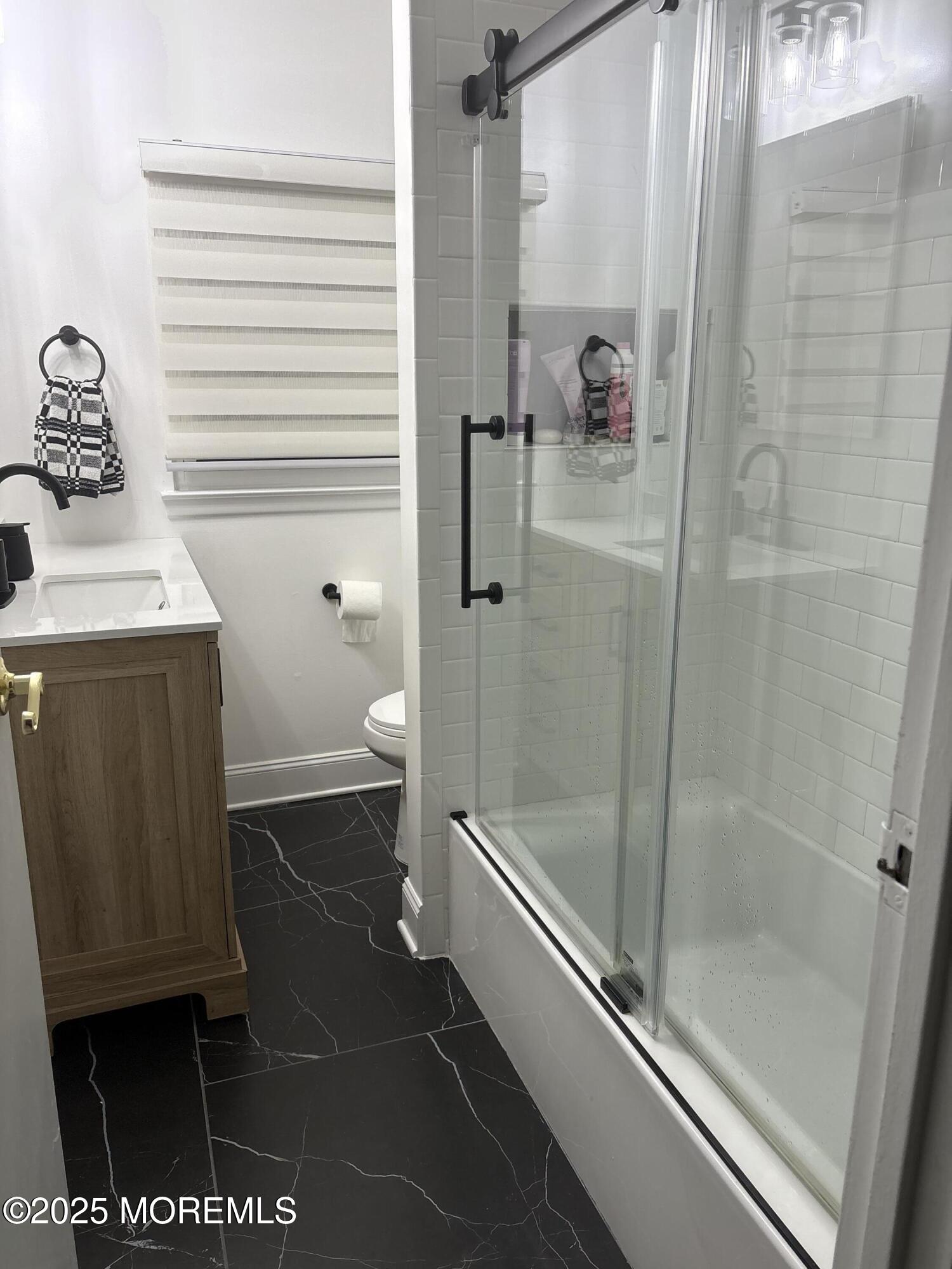 7 Peach Tree Road Oakhurst, NJ 07755 - Photo 10 of 21 a bathroom with a shower and a toilet