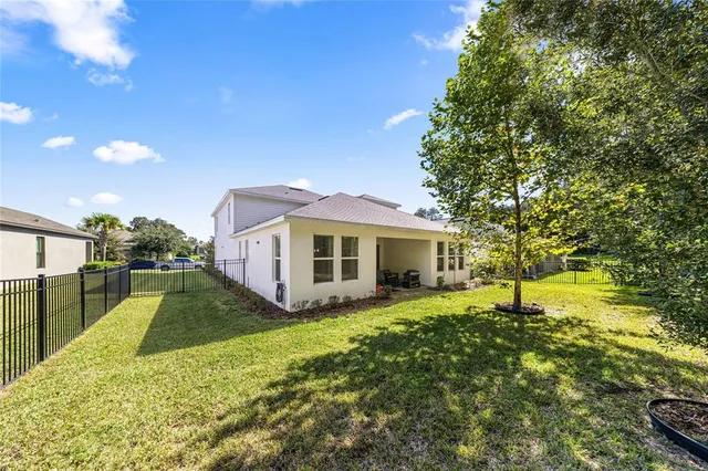 an aerial view of a house with a garden
