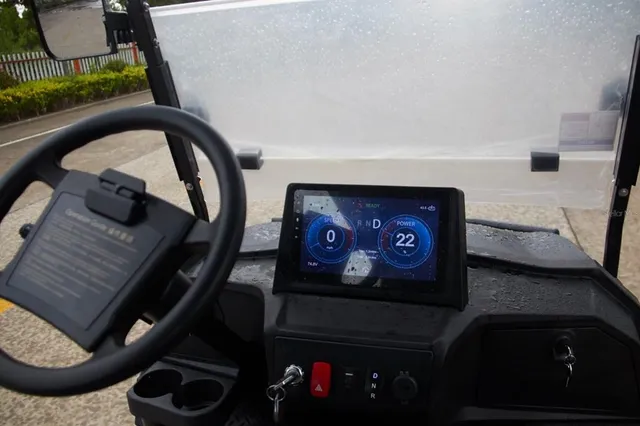 a view of backyard with barbeque and trees