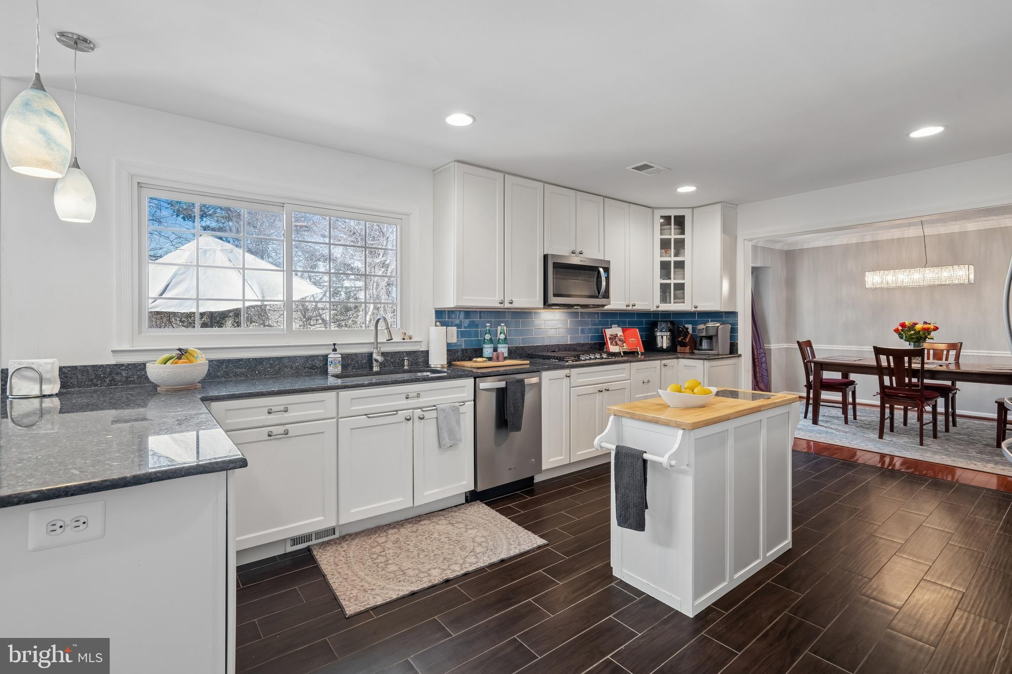 13525 Winding Trail Court Silver Spring, MD 20906 - Photo 11 of 40 a kitchen with granite countertop appliances cabinets and a sink