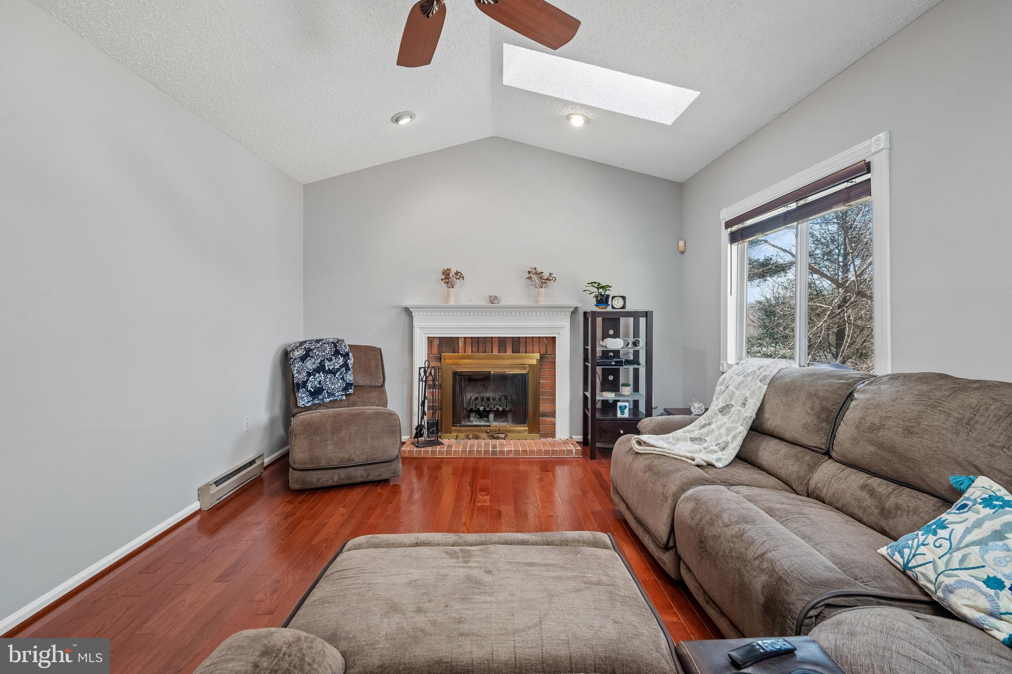 13525 Winding Trail Court Silver Spring, MD 20906 - Photo 15 of 40 a living room with furniture and a fireplace