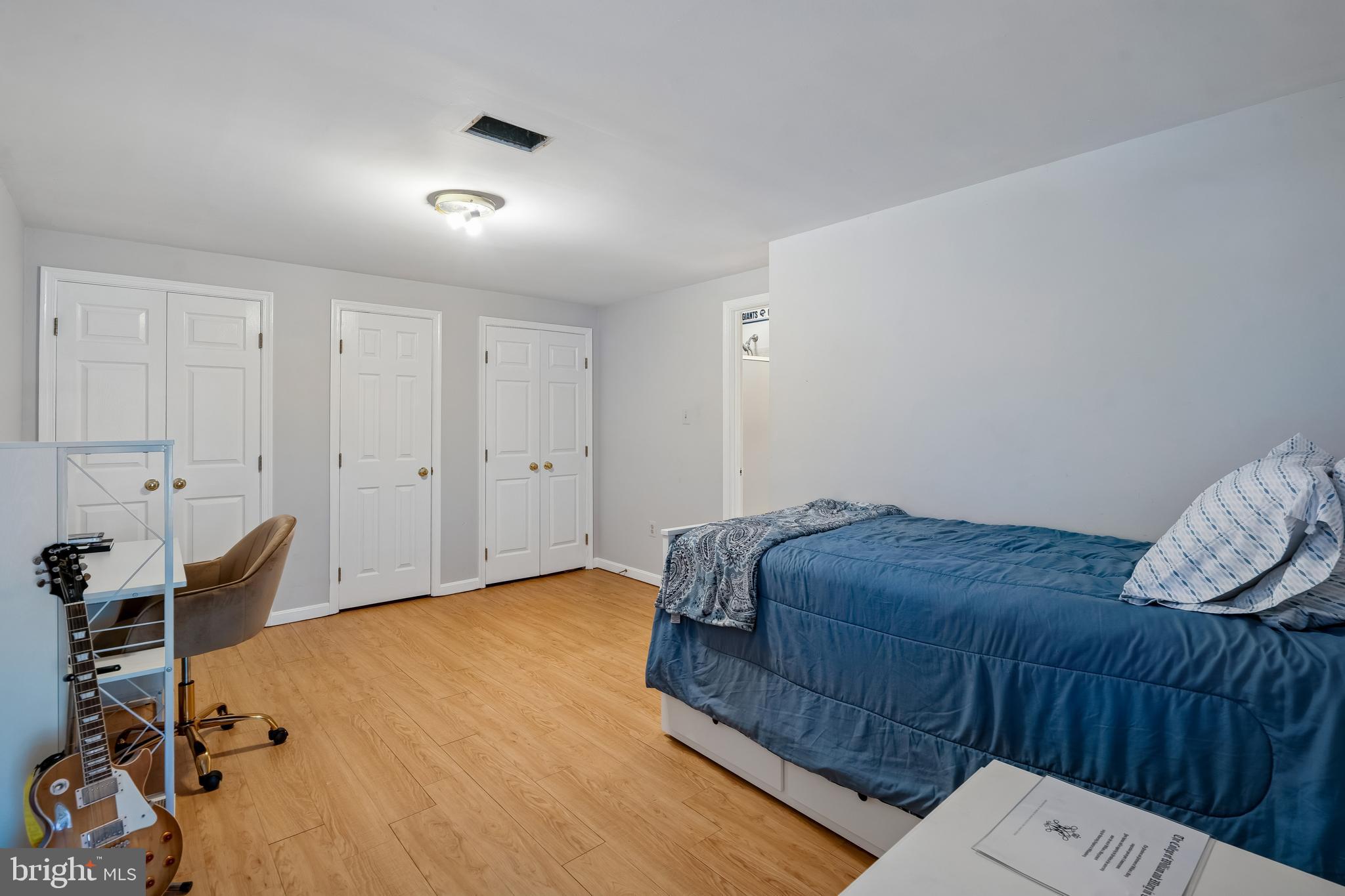 13525 Winding Trail Court Silver Spring, MD 20906 - Photo 29 of 40 a bedroom with a bed and furniture