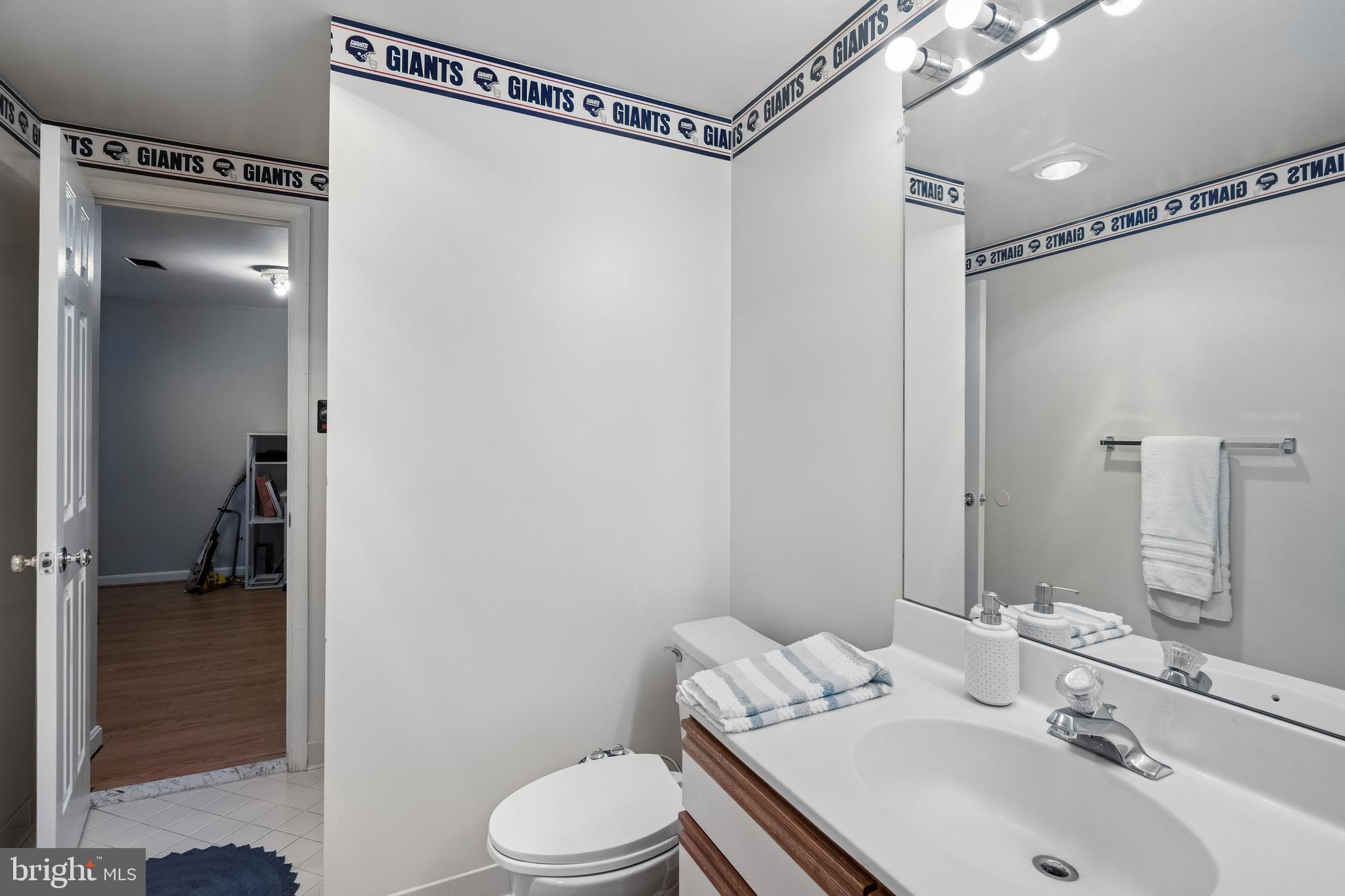 13525 Winding Trail Court Silver Spring, MD 20906 - Photo 31 of 40 a bathroom with a sink toilet and shower