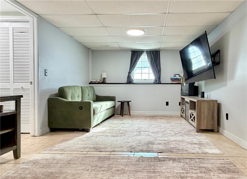 110 West McQuistion Road Butler, PA 16001 - Photo 17 of 32 a living room with furniture and a flat screen tv