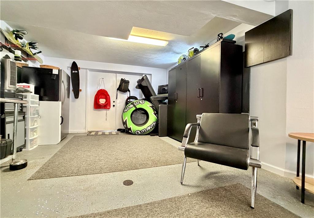 110 West McQuistion Road Butler, PA 16001 - Photo 21 of 32 a living room with a couch and a flat screen tv