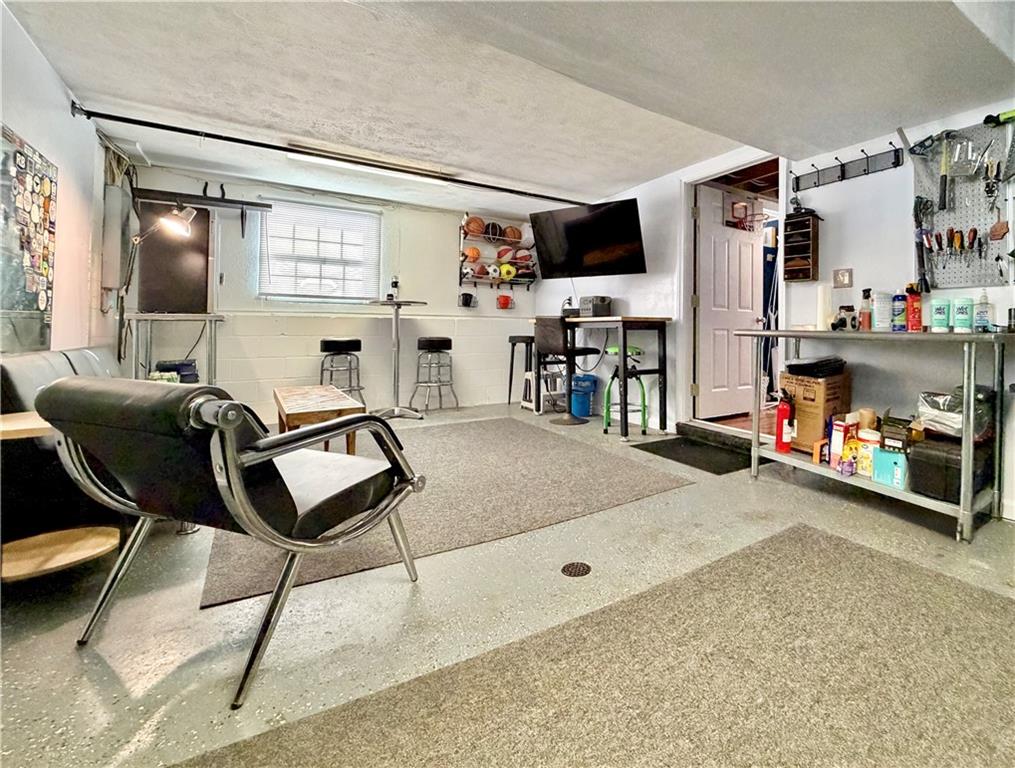 110 West McQuistion Road Butler, PA 16001 - Photo 23 of 32 a living room with furniture a flat screen tv and a table