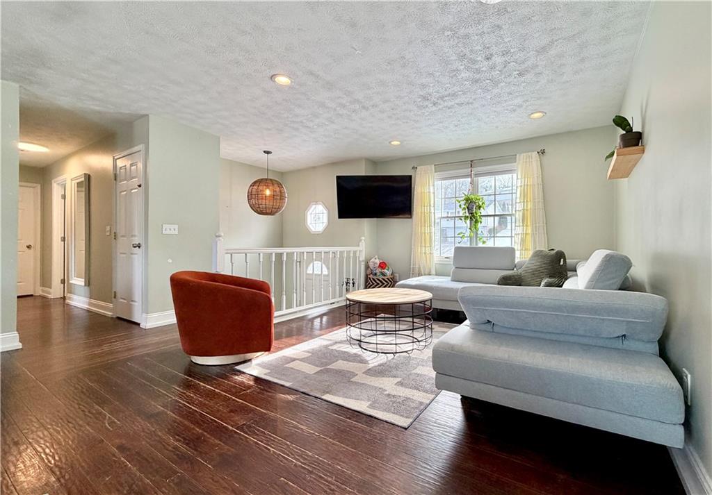 110 West McQuistion Road Butler, PA 16001 - Photo 3 of 32 a living room with furniture rug and a flat screen tv