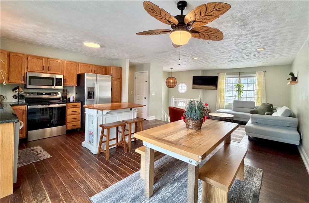 110 West McQuistion Road Butler, PA 16001 - Photo 6 of 32 a view of a dining room with furniture a chandelier and wooden floor