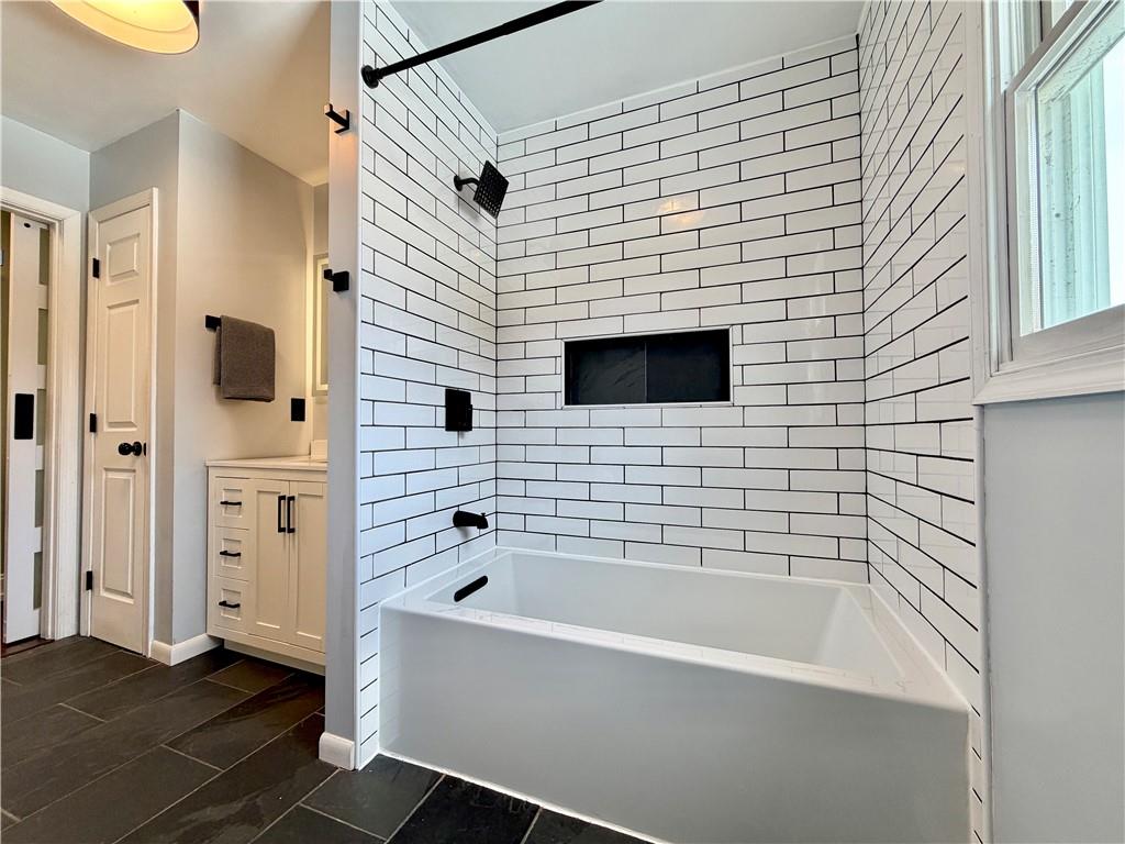 110 West McQuistion Road Butler, PA 16001 - Photo 10 of 32 a bathroom with a bathtub and a shower