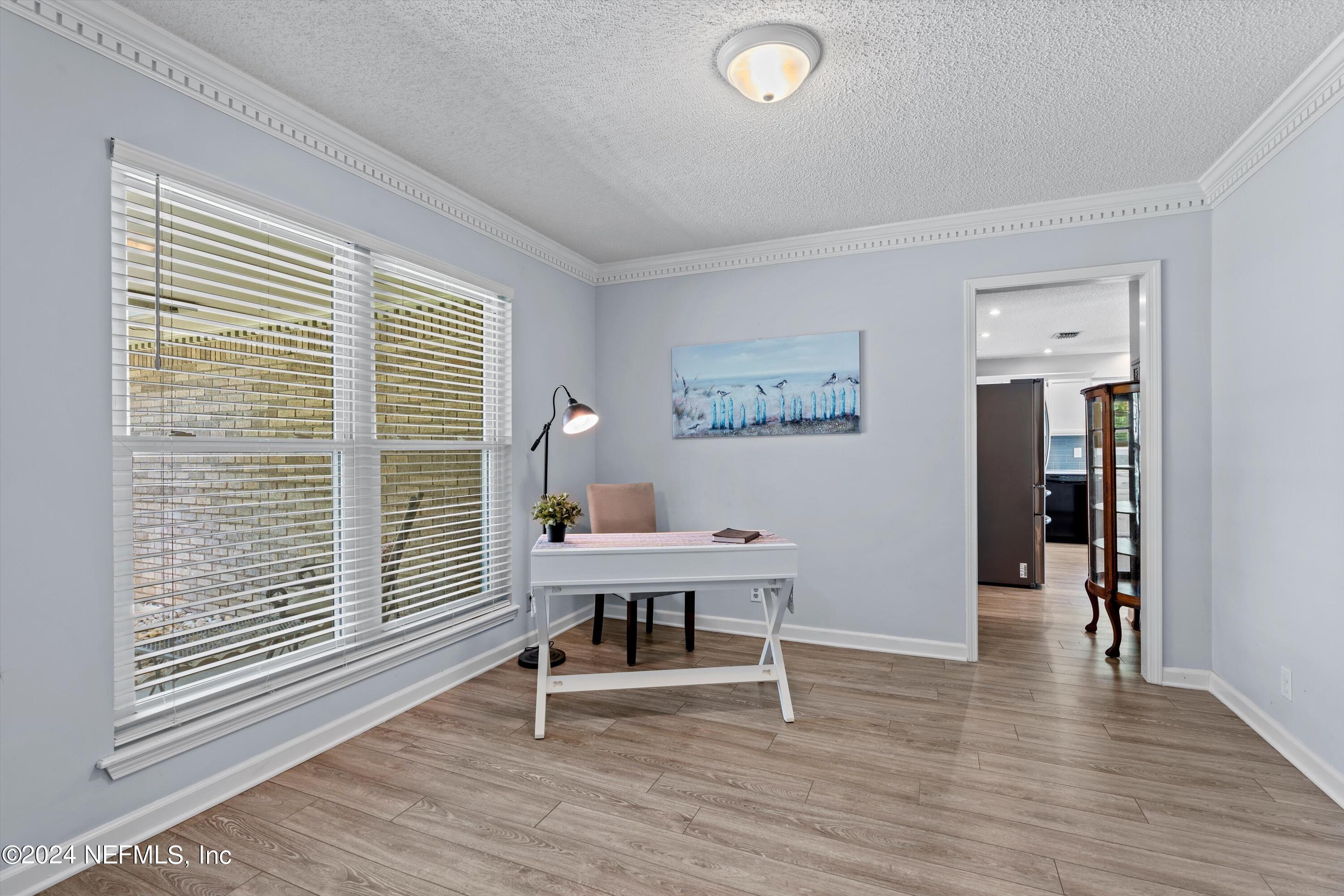 1474 Fruit Cove Forest Road North St. Johns, FL 32259 - Photo 10 of 36 a view of a workspace with furniture and a window
