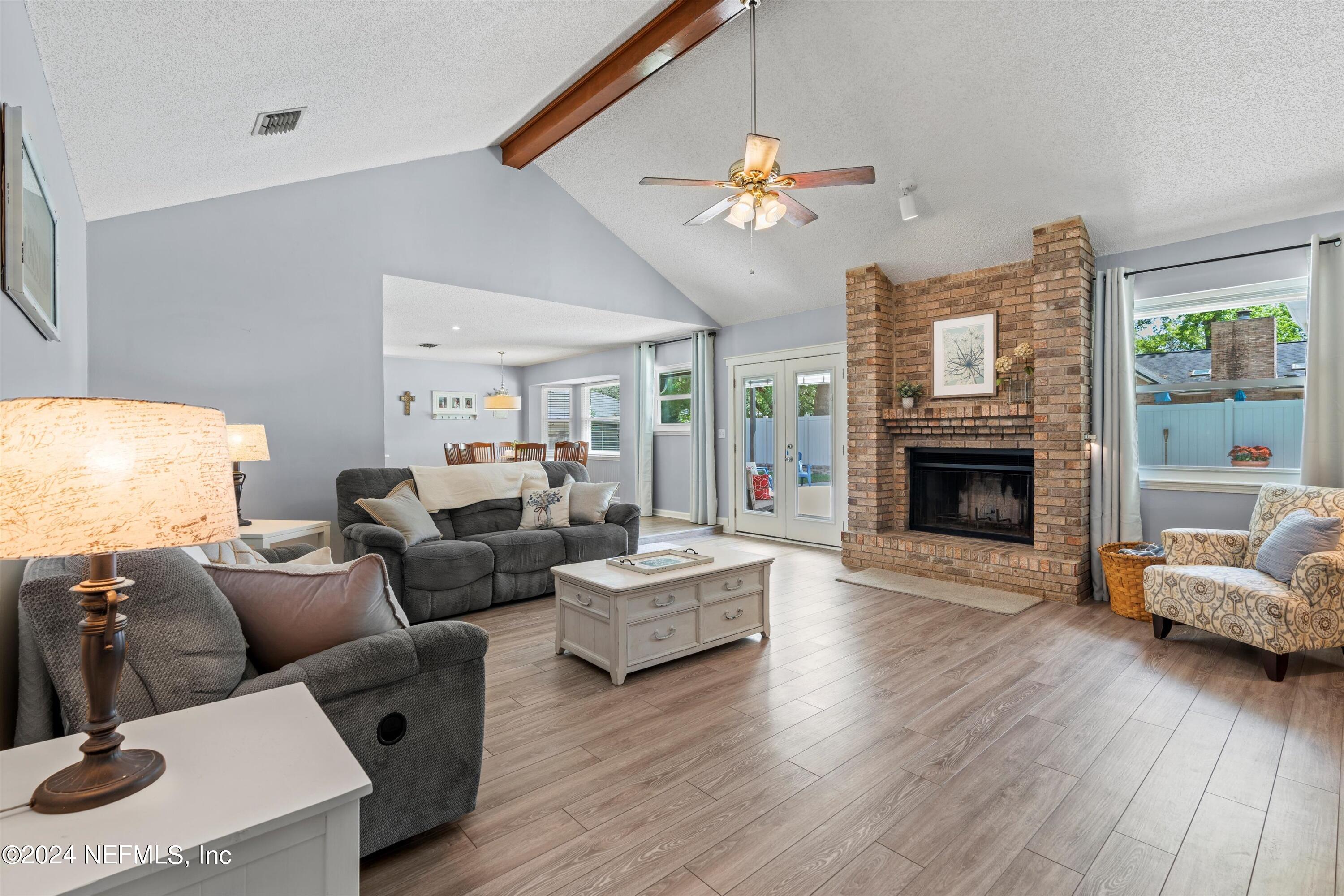 1474 Fruit Cove Forest Road North St. Johns, FL 32259 - Photo 11 of 36 a living room with furniture and a fireplace