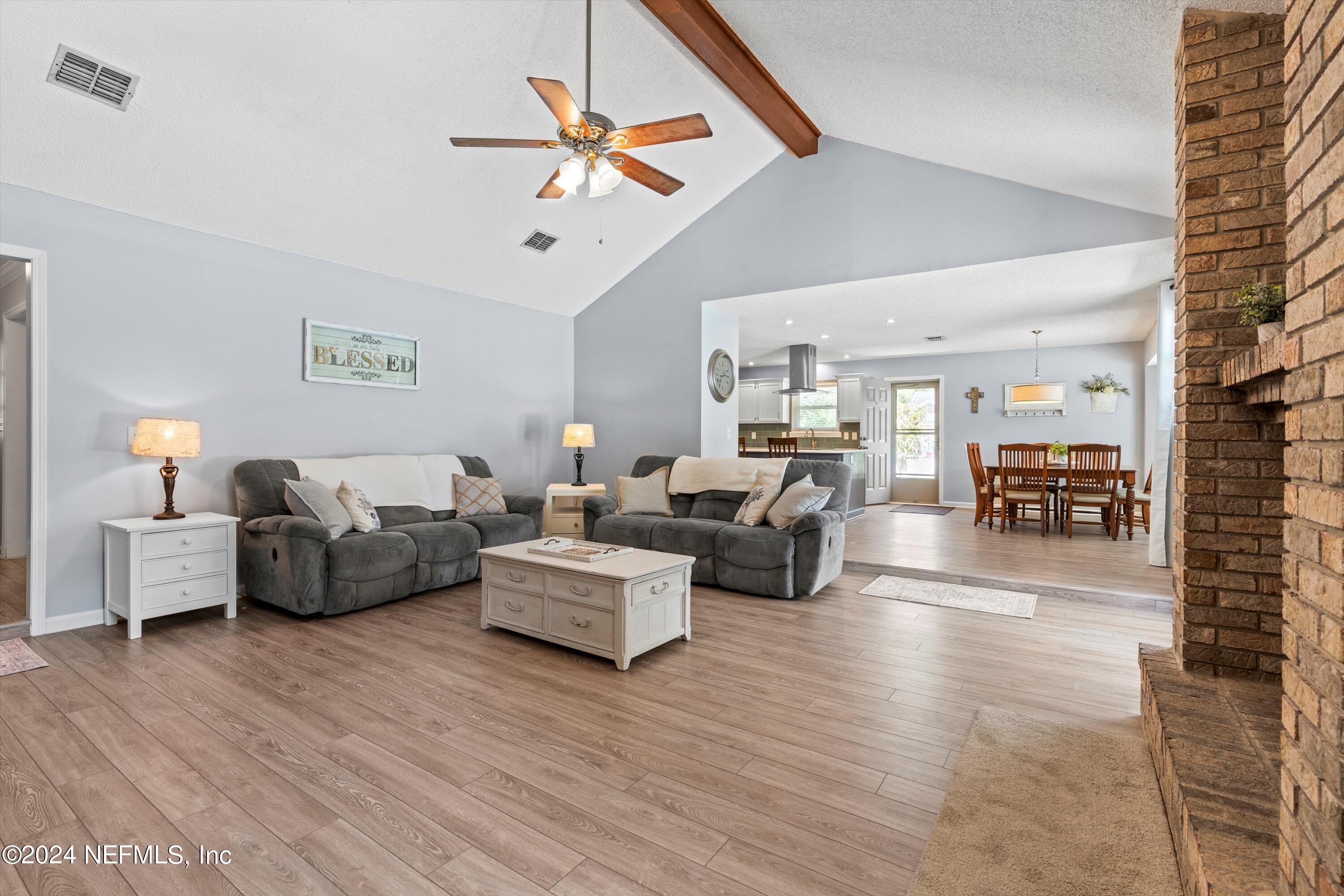 1474 Fruit Cove Forest Road North St. Johns, FL 32259 - Photo 12 of 36 a living room with furniture and a wooden floor