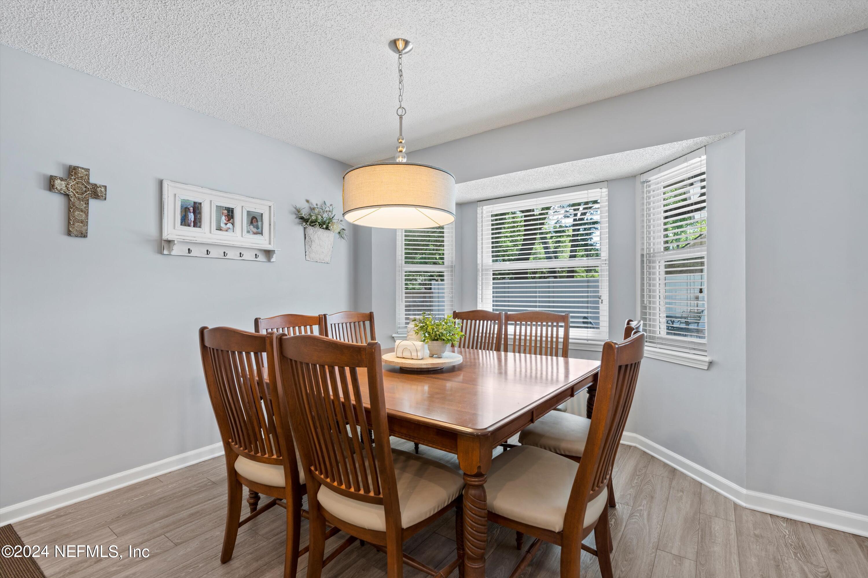 1474 Fruit Cove Forest Road North St. Johns, FL 32259 - Photo 16 of 36 a view of a dining room with furniture window and outside view