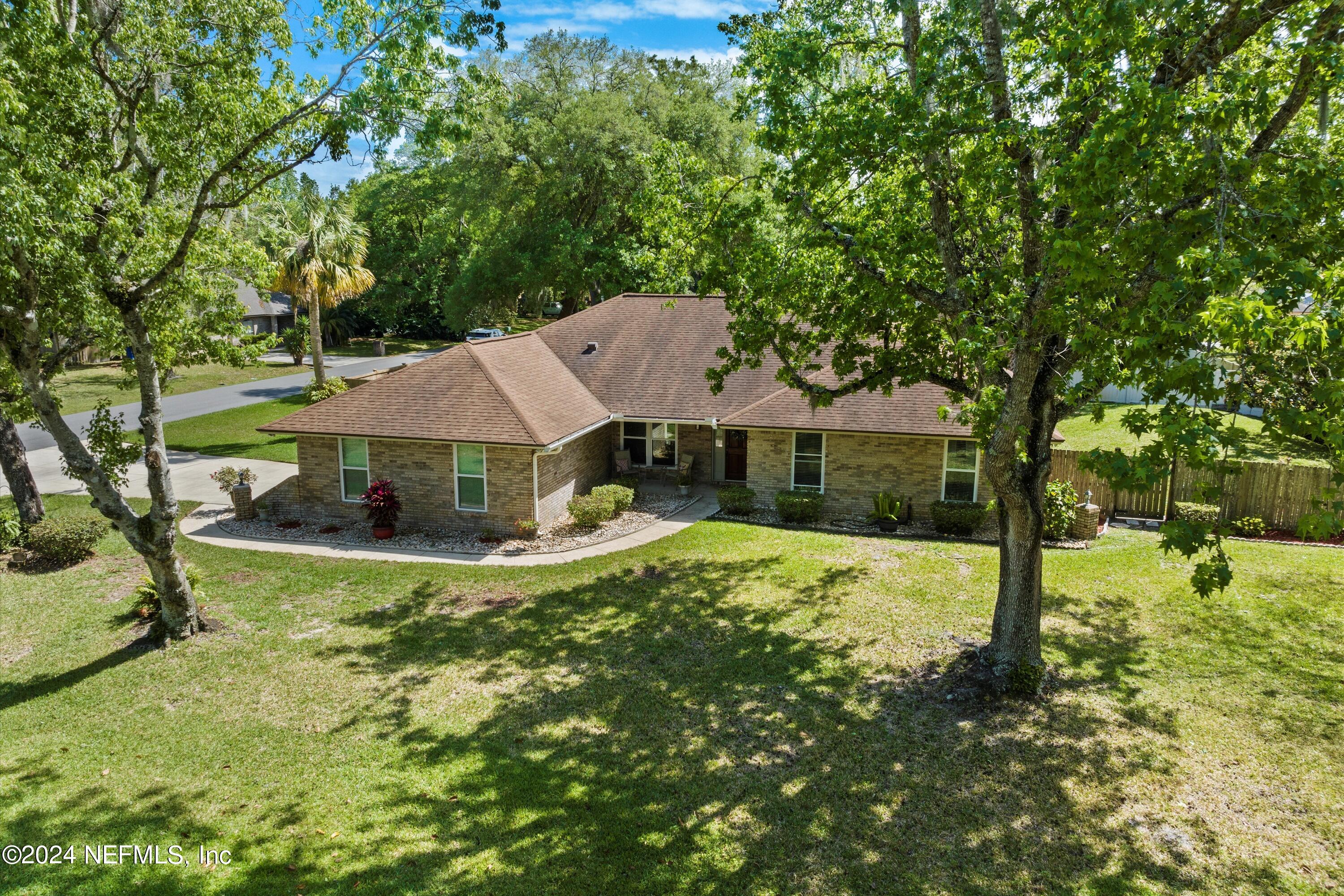 1474 Fruit Cove Forest Road North St. Johns, FL 32259 - Photo 2 of 36 a view of a house with yard and sitting area