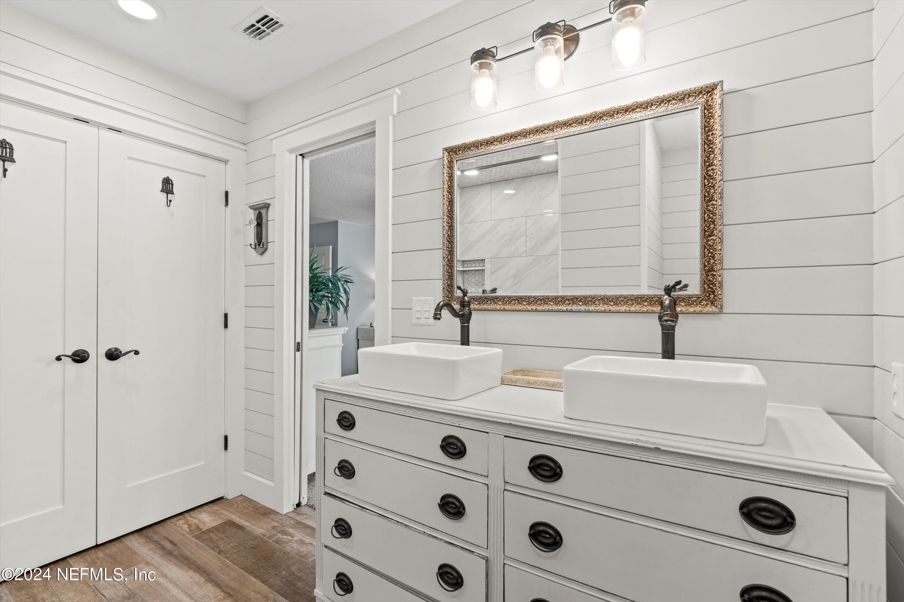 1474 Fruit Cove Forest Road North St. Johns, FL 32259 - Photo 20 of 36 a bathroom with a sink and a mirror
