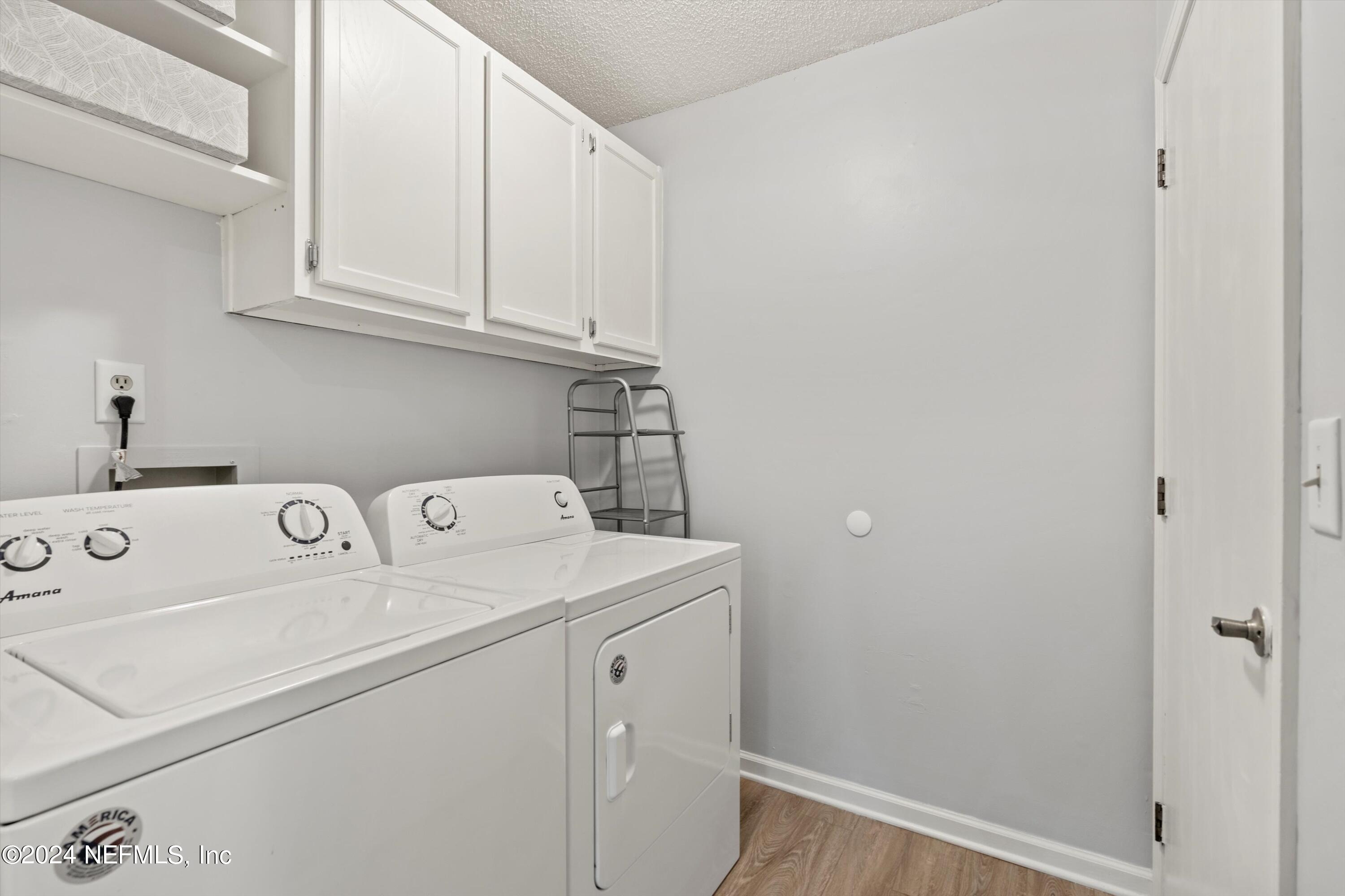 1474 Fruit Cove Forest Road North St. Johns, FL 32259 - Photo 27 of 36 a utility room with dryer and washer