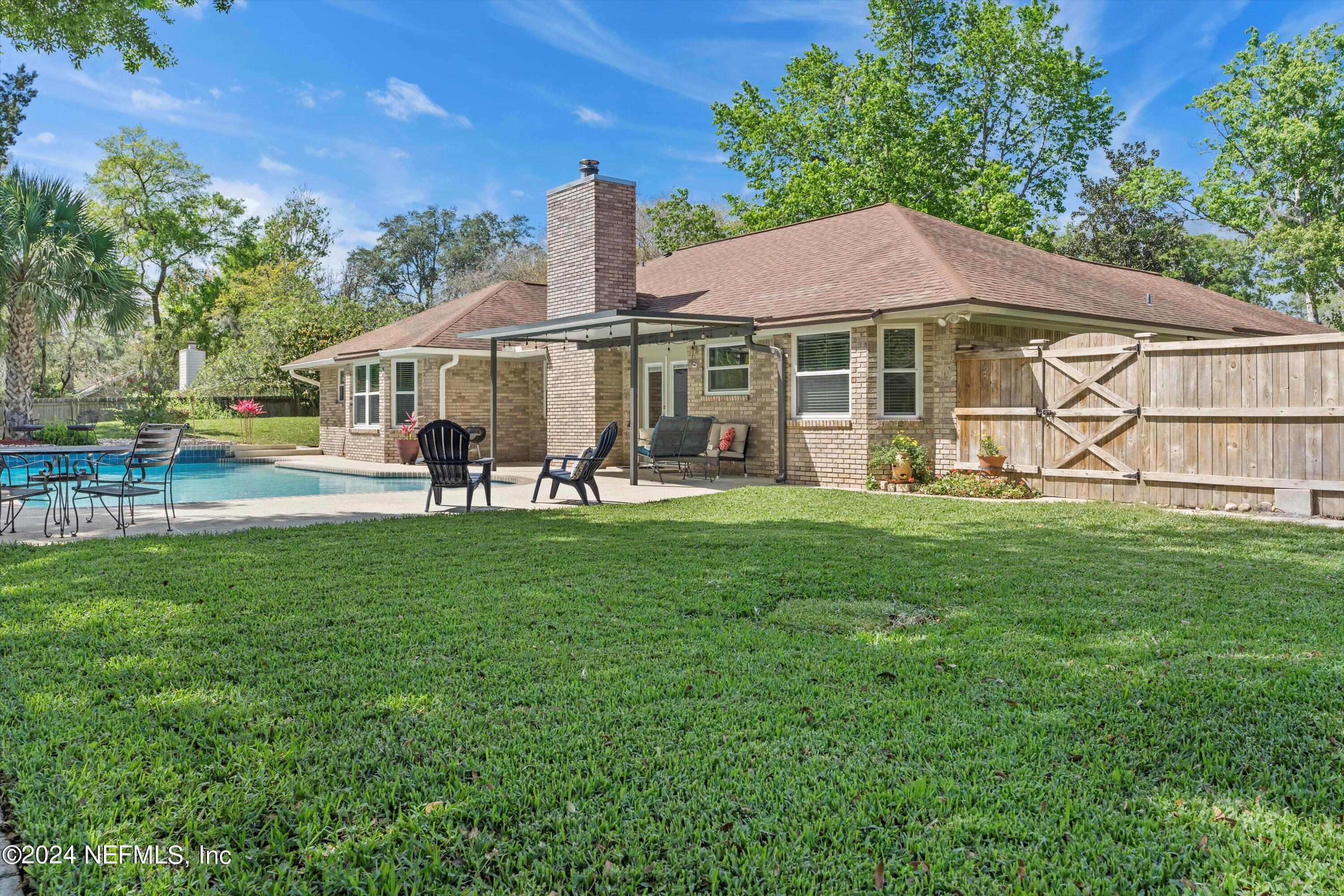 1474 Fruit Cove Forest Road North St. Johns, FL 32259 - Photo 32 of 36 a front view of a house with garden