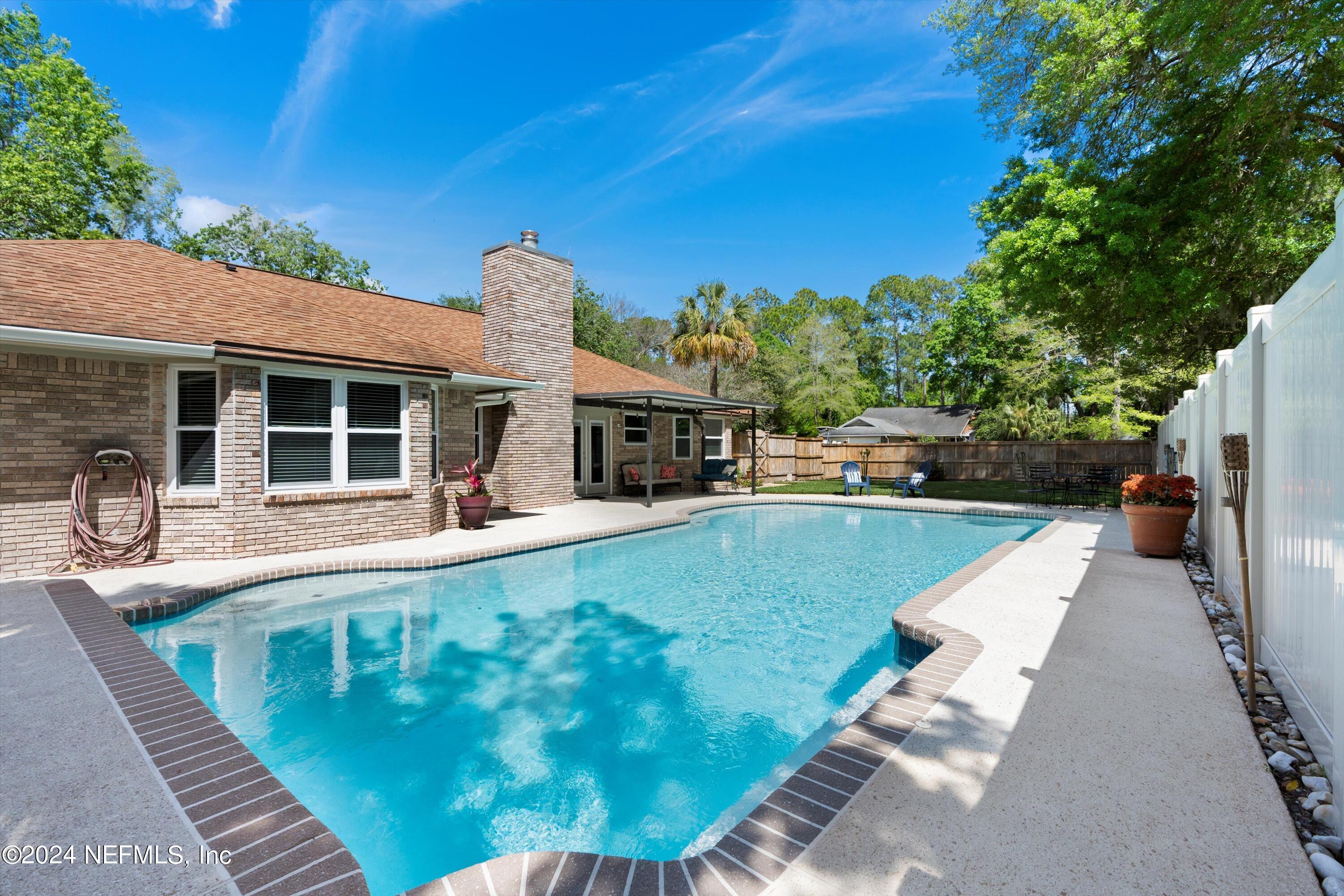 1474 Fruit Cove Forest Road North St. Johns, FL 32259 - Photo 33 of 36 a view of a house with a swimming pool