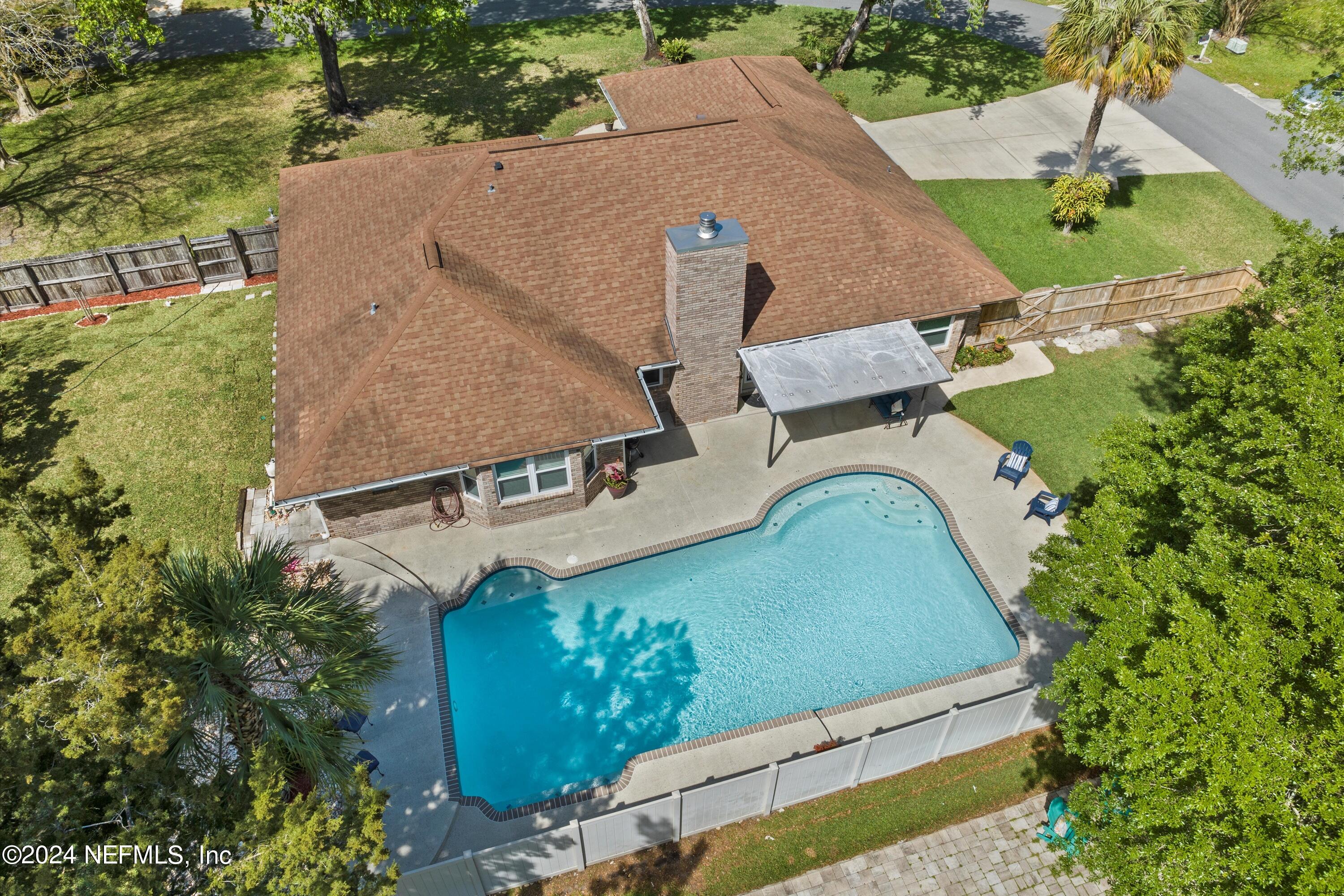 1474 Fruit Cove Forest Road North St. Johns, FL 32259 - Photo 34 of 36 an aerial view of a house with a yard and lake view