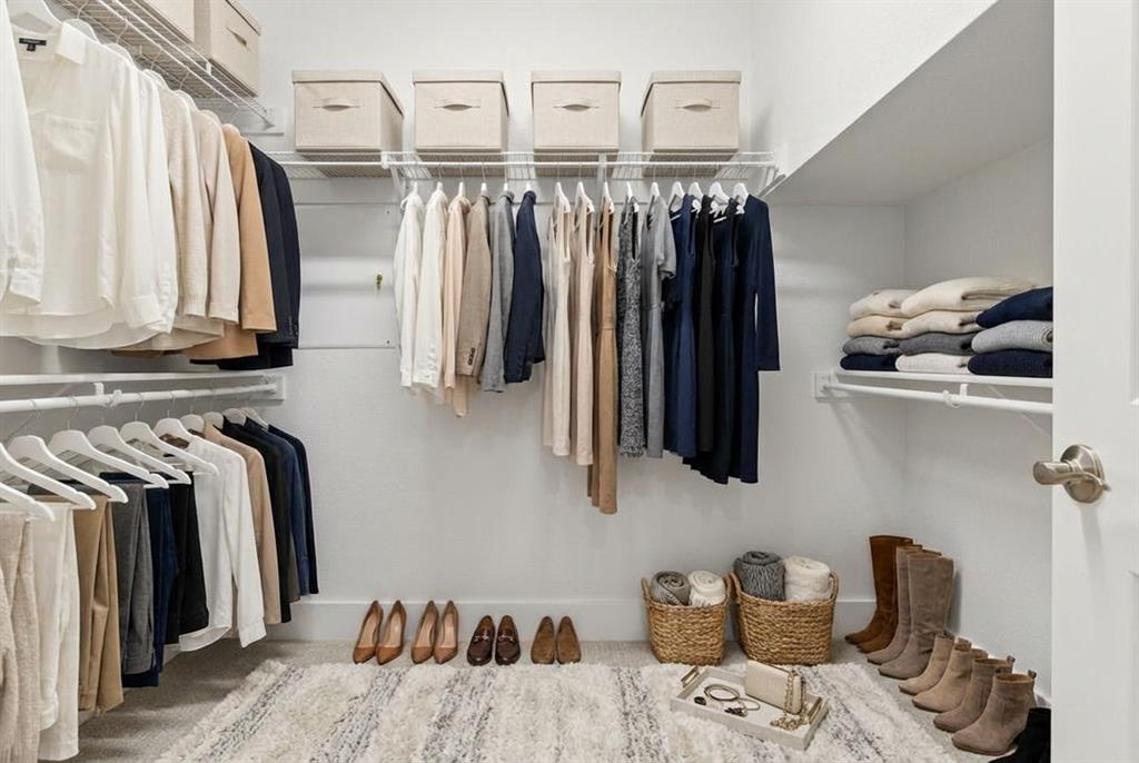 12831 Pne Rdg Trail Wylie, TX 75098 - Photo 10 of 12 a view of walk in closet with clothes and shoes