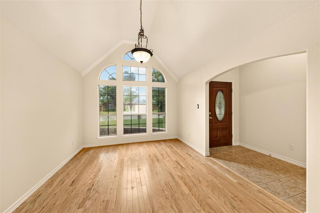 2105 Ridgewood Drive Bridgeport, TX 76426 - Photo 5 of 27 Elegant formal dining room with soaring ceilings and abundant natural light