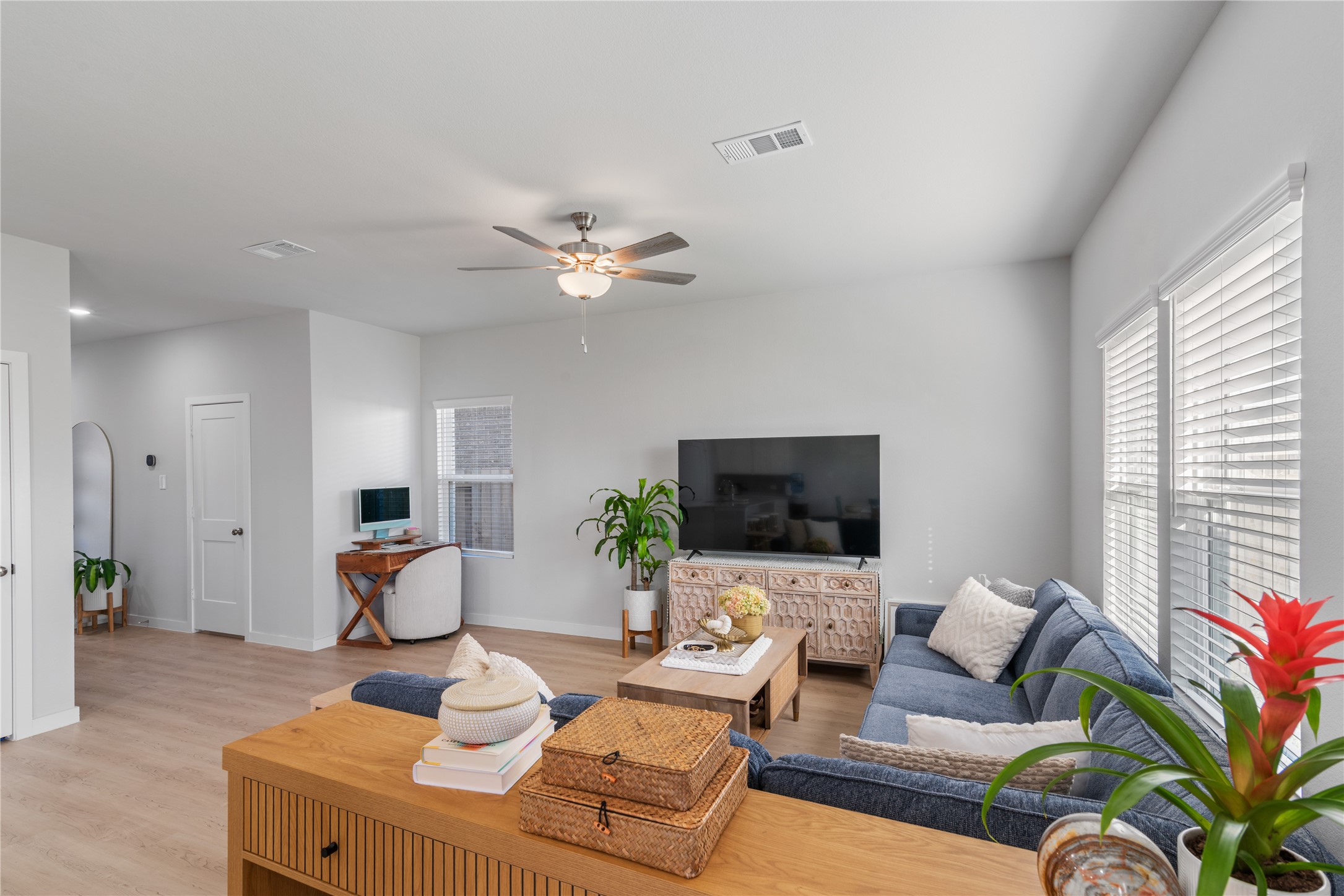 123 Alset Circle Magnolia, TX 77354 - Photo 11 of 27 a living room with furniture and a flat screen tv