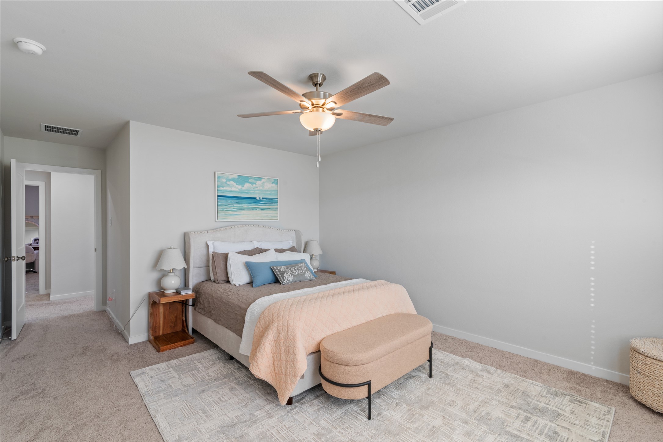 123 Alset Circle Magnolia, TX 77354 - Photo 14 of 27 a bedroom with a bed and a chandelier