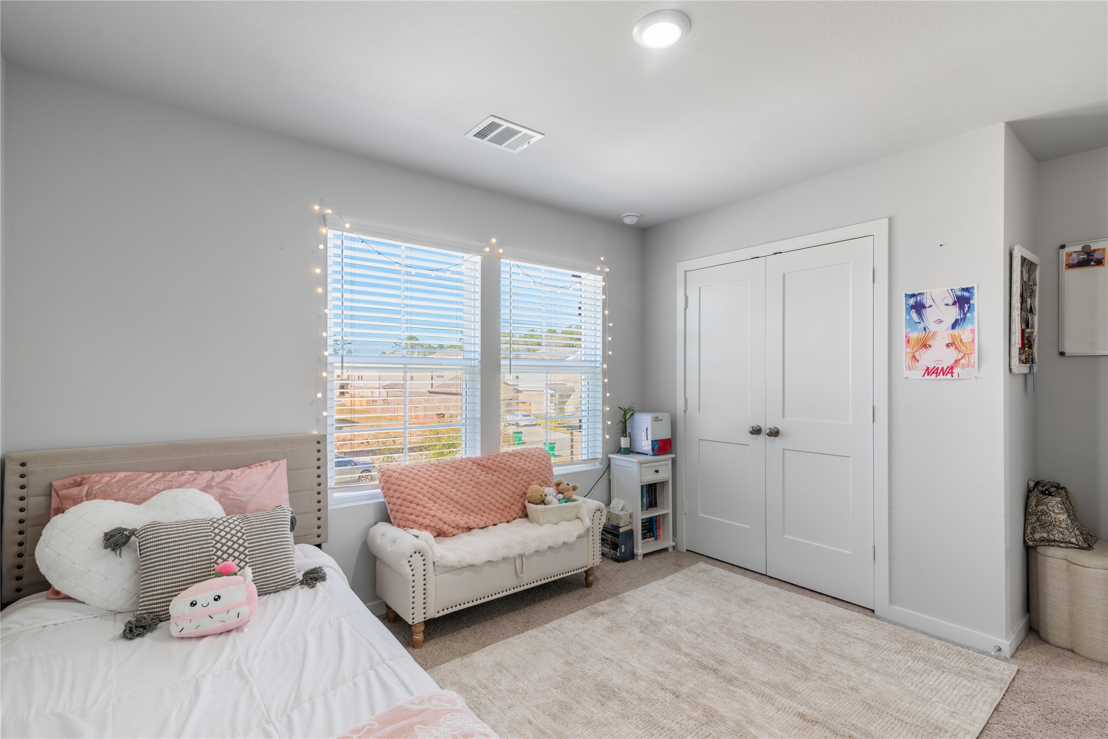 123 Alset Circle Magnolia, TX 77354 - Photo 19 of 27 a bedroom with a bed and a couch