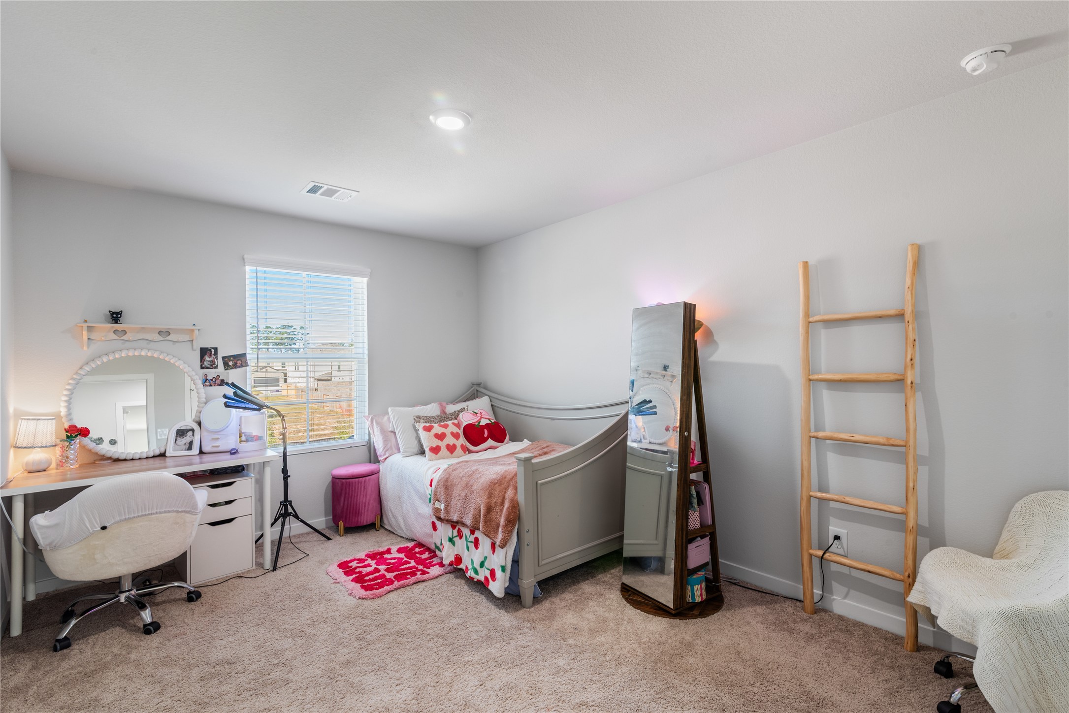 123 Alset Circle Magnolia, TX 77354 - Photo 21 of 27 a bedroom with furniture and a couch