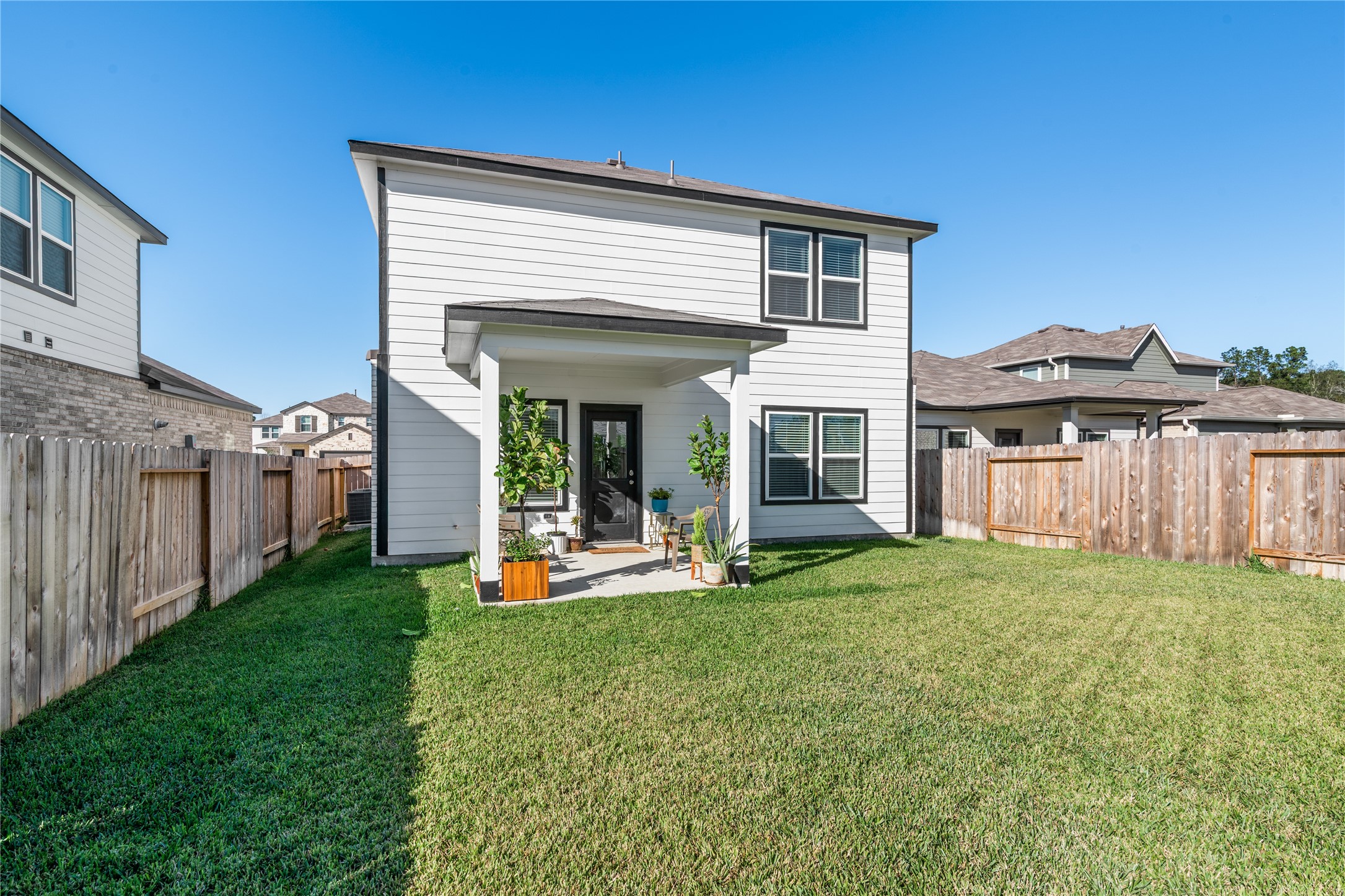 123 Alset Circle Magnolia, TX 77354 - Photo 27 of 27 a view of a house with backyard porch and garden