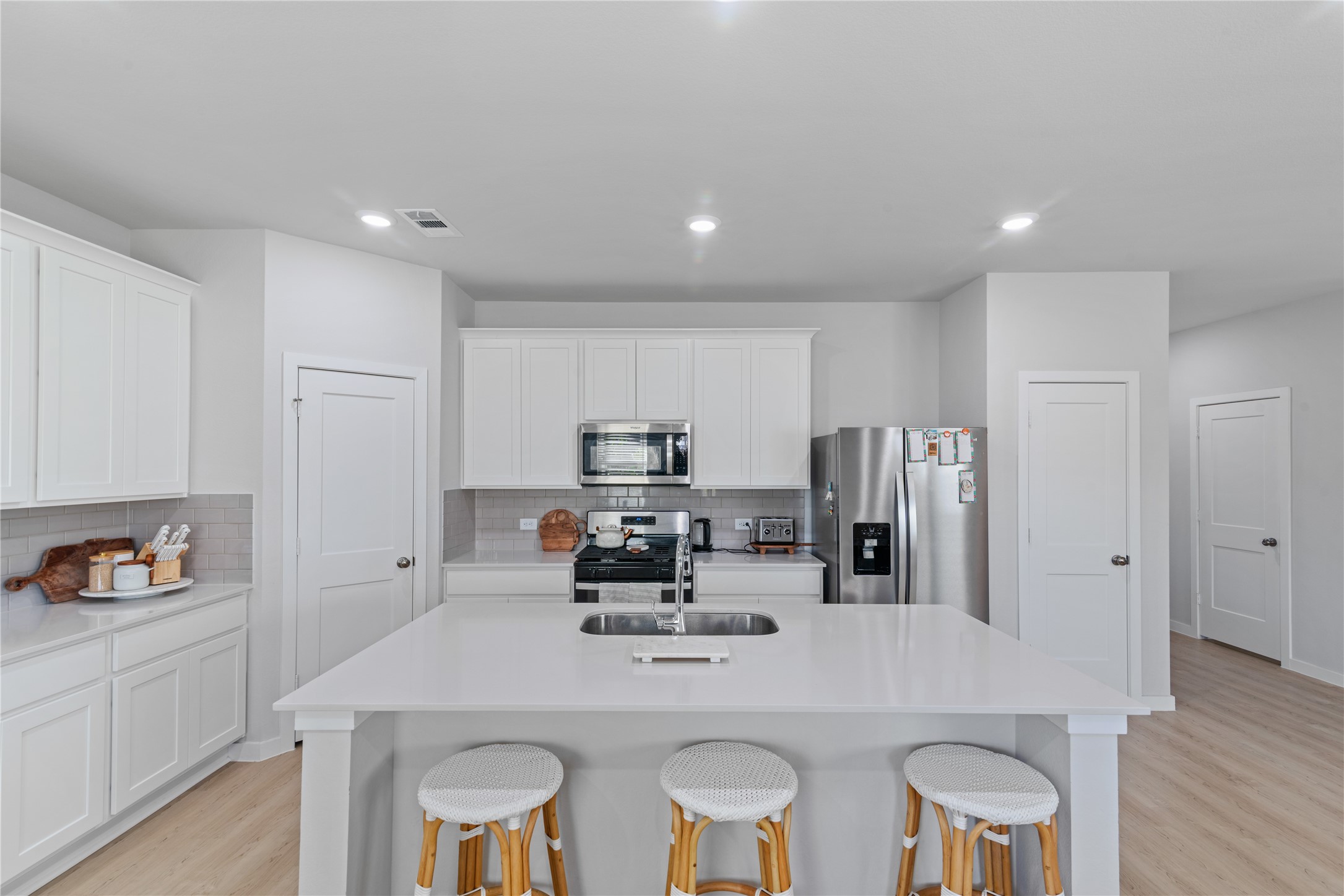 123 Alset Circle Magnolia, TX 77354 - Photo 5 of 27 a kitchen with refrigerator and cabinets