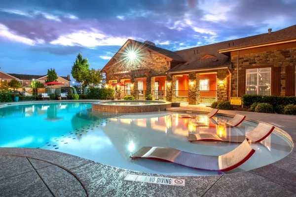 a view of a swimming pool with a patio