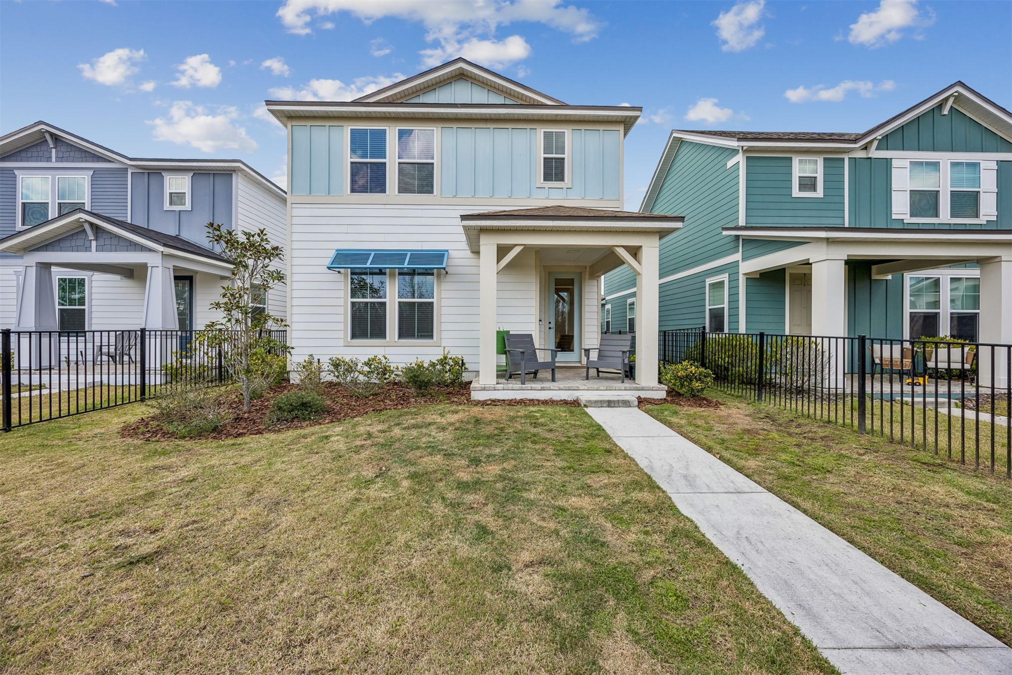 236 Hawthorn Park Circle Yulee, FL 32097 - Photo 1 of 28 a front view of a house with a yard