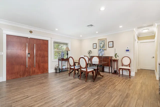 a view of a dining room with furniture and wooden floor