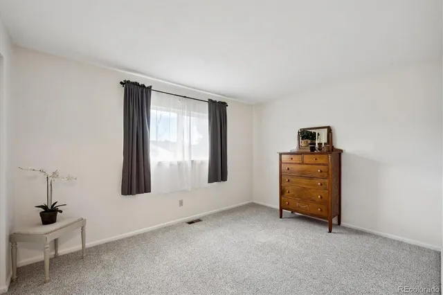 a view of a storage and utility room with washer and dryer