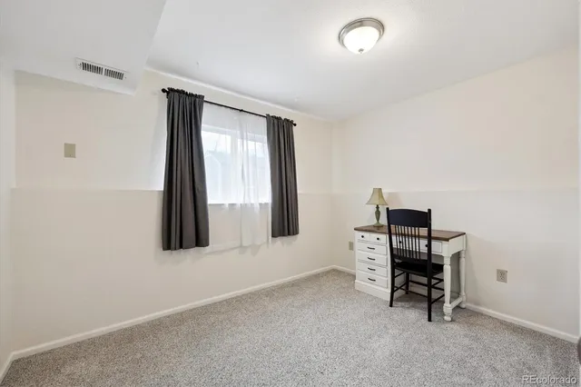 an aerial view of residential houses with outdoor space and ocean view