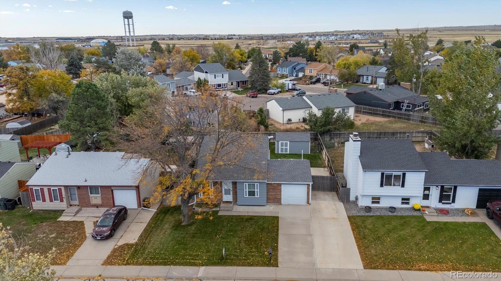 704 Madison Way Bennett, CO 80102 - Photo 26 of 29 an aerial view of multiple houses
